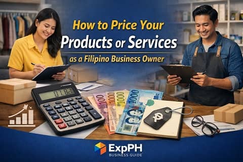 Filipino business owners calculating product pricing in the Philippines using calculator peso bills and clipboard in a small business setting