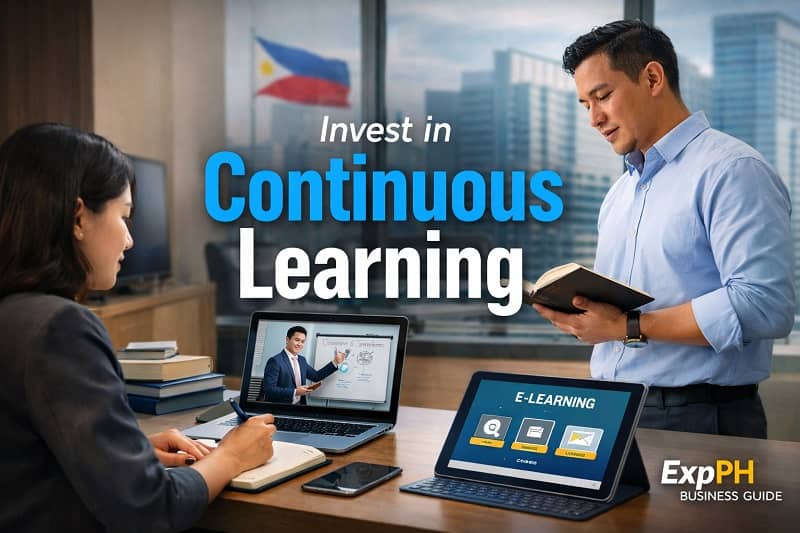 Filipino professionals investing in continuous learning through books and online courses in a modern Philippine office environment