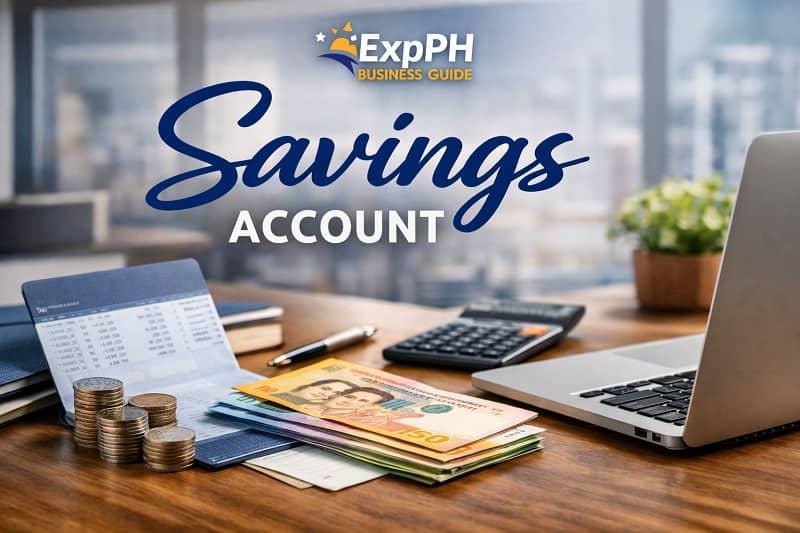Savings account concept with Philippine peso bills coins bank passbook calculator and laptop on a business desk with ExpPH Business Guide logo