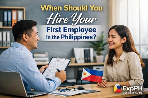 Filipino business owner interviewing job applicant in a Philippine office setting about hiring a first employee