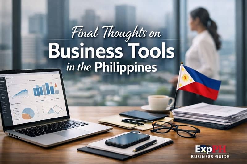 Modern office desk with laptop analytics, Philippine flag, and business tools representing final insights on business tools in the Philippines