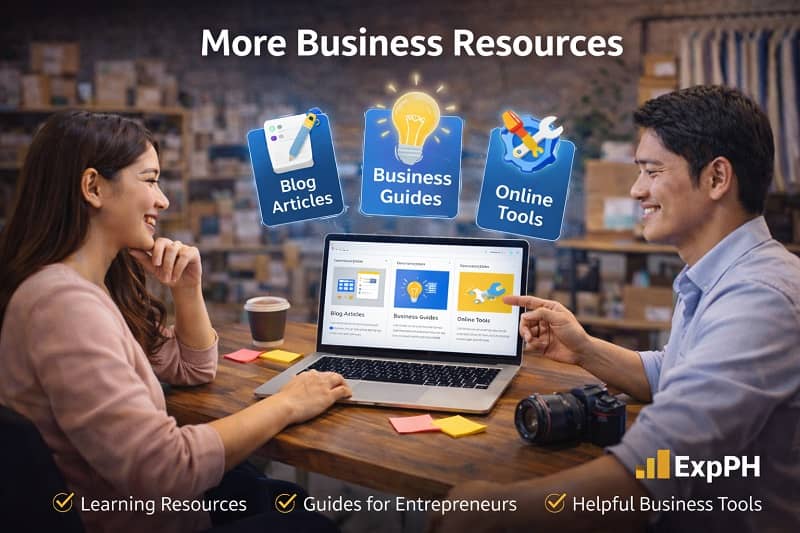 Filipino entrepreneurs exploring business guides and online resources on a laptop in a small business workspace