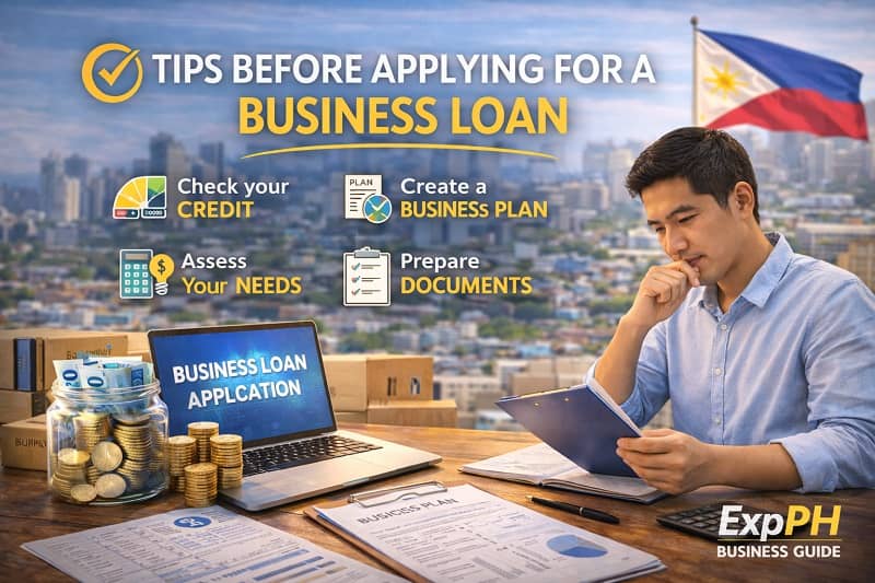 Filipino entrepreneur reviewing documents and business plan before applying for a business loan with laptop, calculator, and financial records