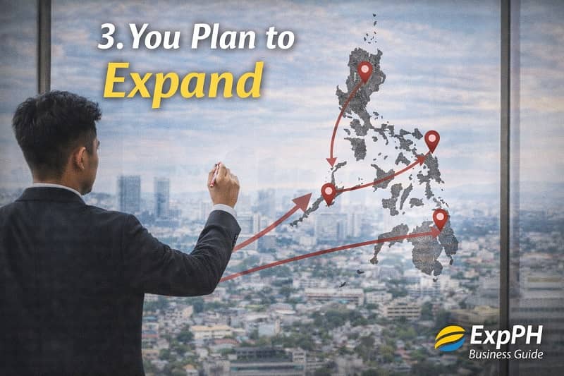 Filipino entrepreneur reviewing expansion plans with multiple locations on a map, representing business growth and expansion in the Philippines