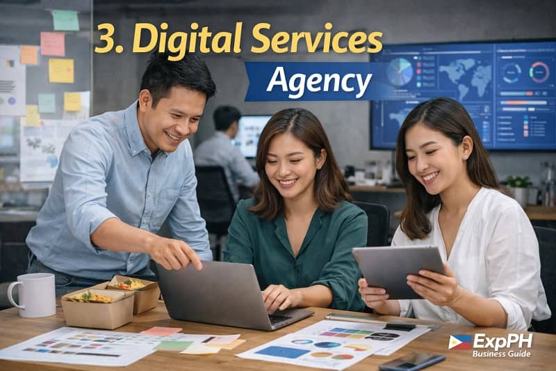 Filipino digital services agency team collaborating with laptop and tablet in a modern office workspace