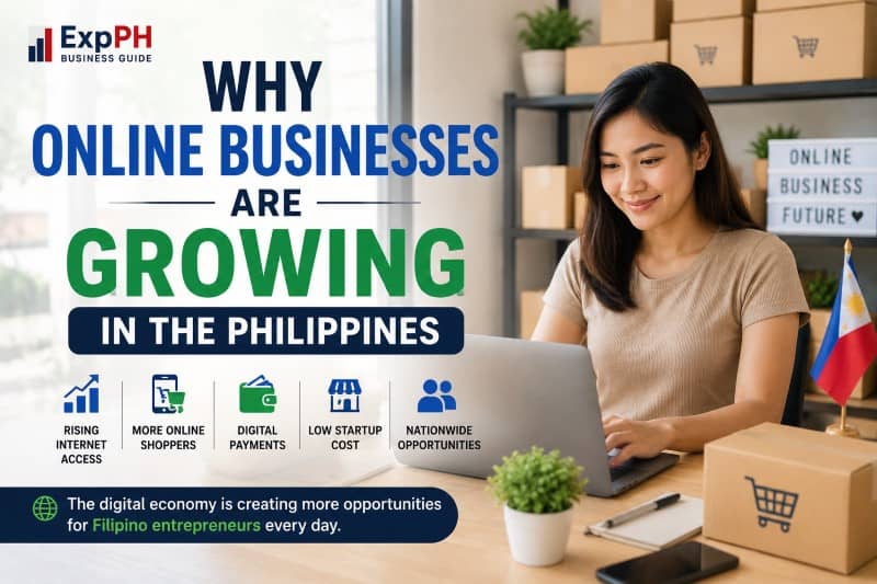A Filipino entrepreneur working on a laptop at a home desk, surrounded by shipping boxes.
